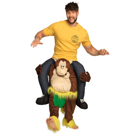Aap instapkostuum volwassenen: bruine broek met pluchen aap, gele poten en groene blaadjes, voor een themafeest