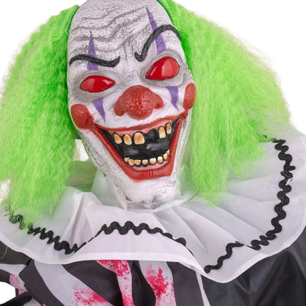 Close-up clownskop met scheve tanden, paarse streepjes en groen haar van de tafelclown