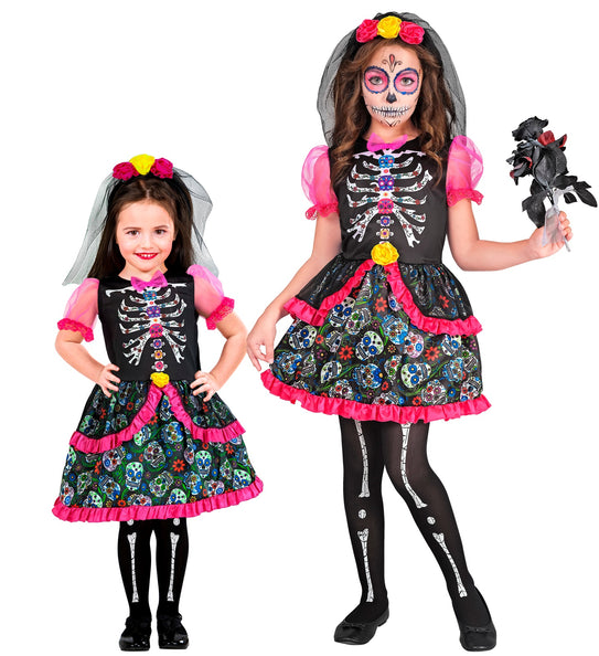 Dag van de doden jurk Anouk kinderen in twee maten, zwart met sugar-skullrok en roze ruches, voor Halloween