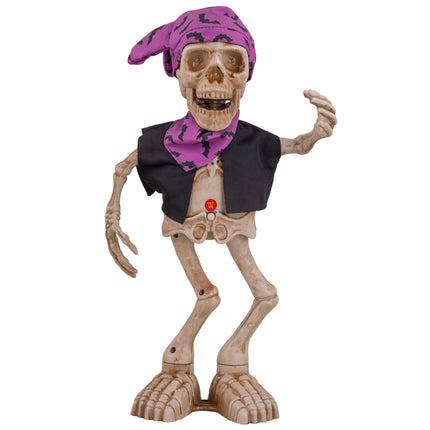 Dansend skelet 40 cm van pvc met paarse vleermuizenbandana, zwart vest en drukknop op de buik