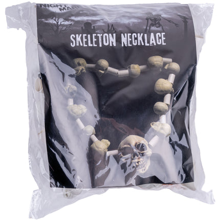 Doodshoofden halsketting in de verpakking, met de botkleurige schedelketting op de voorkant