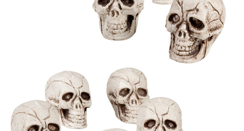 Doodskoppen deco: twaalf witte schedels van 4x3 cm met gebarsten reliëf en open kaak voor Halloween
