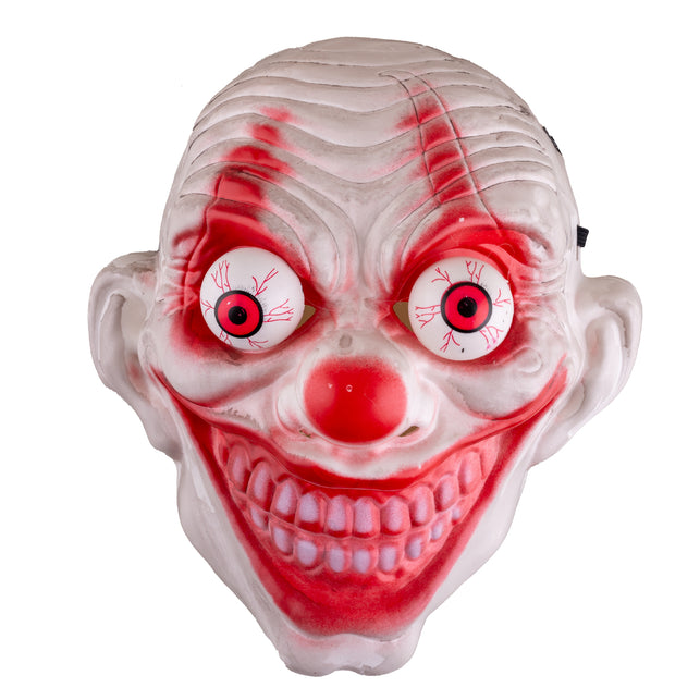 Evil clown masker halloween in close-up met bloeddoorlopen wiebelogen en rode tandengrijns