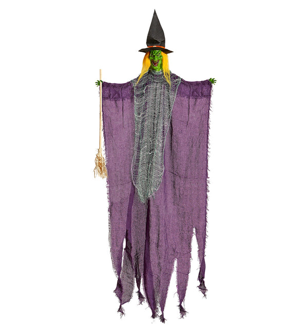 Heks met bezem decoratie 138 cm met paars gerafeld gewaad en groen gezicht voor Halloween