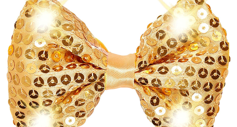 Knipperende gouden strikjes met pailletten en oplichtende ledlampjes, close-up