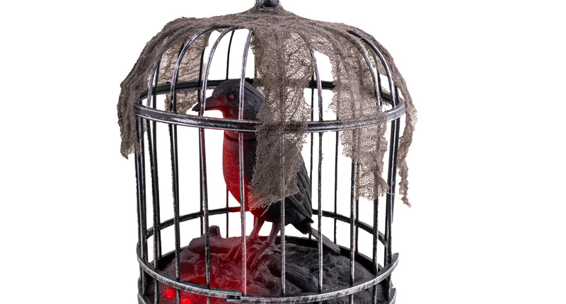 Kraai in kooi van 32 cm, zwart-grijze vogelkooi met rood oplichtende kraai en flarden gaas voor Halloween