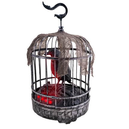Kraai in kooi van 32 cm, zwart-grijze vogelkooi met rood oplichtende kraai en flarden gaas voor Halloween