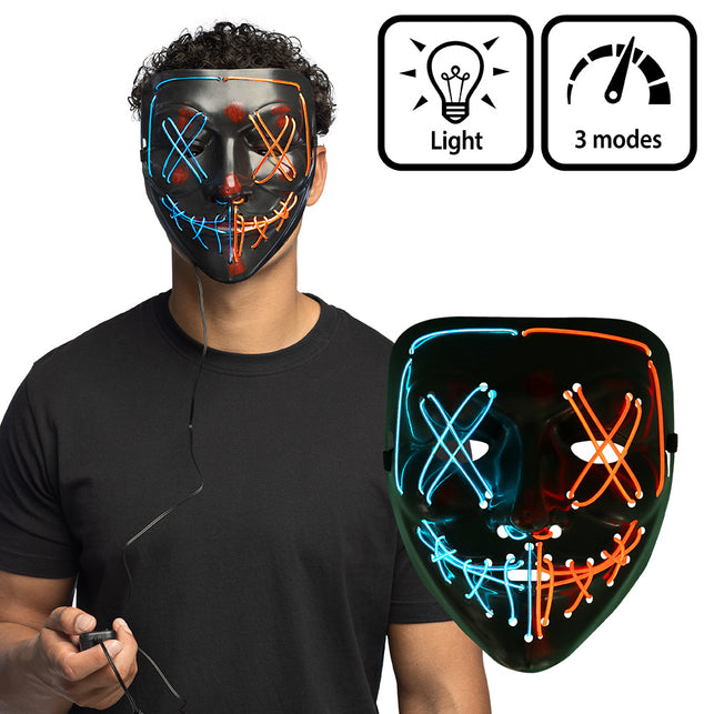 LED masker Killer smile duo zwart met blauwe en oranje lichtlijnen, gedragen met batterijkastje in de hand