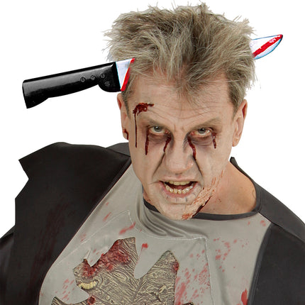 Mes door hoofd hoofdband op zombielook, zilveren punt en zwart heft aan weerszijden