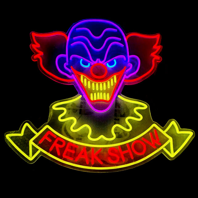 Neonbord clown Freak Show met blauwe kop, rode haarplukken en geel lint, voor Halloween