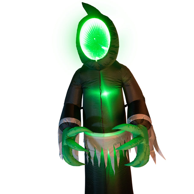 Opblaasbaar spook met LED van dichtbij, groen verlicht gezichtsvlak boven gerafelde witte franjerand
