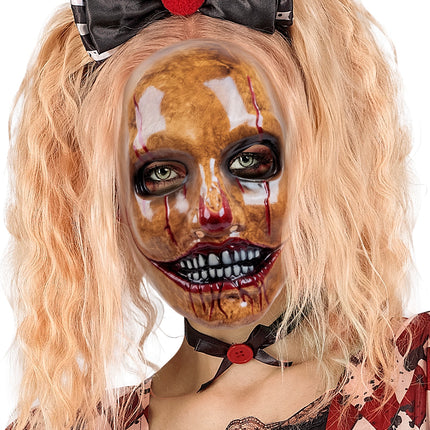 Psycho clown masker close-up: glanzende bruine schildering met rode druipsporen