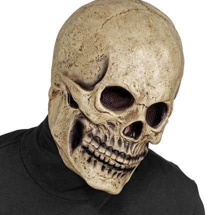 Schedel masker latex schuin van voren, met bruine barstlijnen over de kale hersenpan