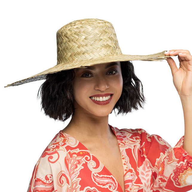 Strohoed Havana in naturel stro met brede rand, gedragen door een vrouw op een tropisch themafeest