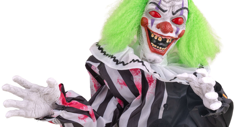 Tafelclown animatronic 35 cm met groen haar en zwart-wit gestreepte outfit voor Halloween