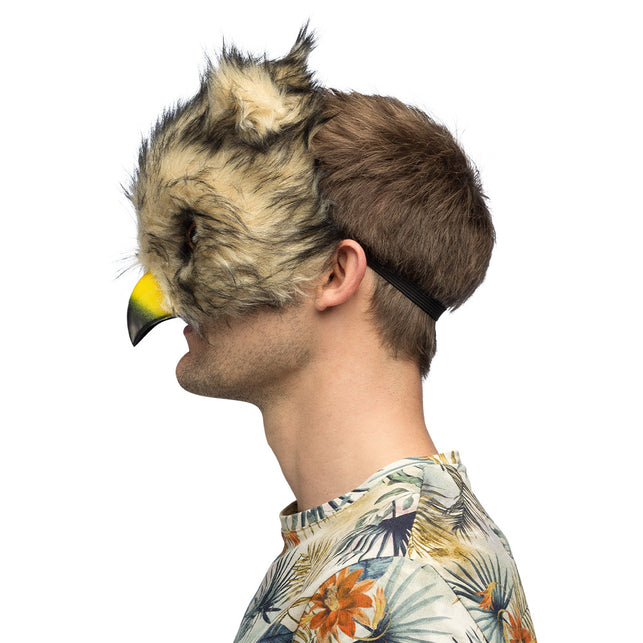 Uilenmasker zijkant met zwart elastiek achter het hoofd en opstaande oorpluim