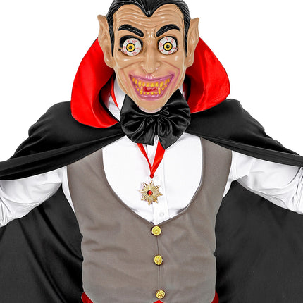 Vampiermasker met wiebelende ogen gedragen bij een cape en strik op een Halloweenfeest