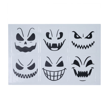 Vel met zes zwarte halloween glasstickers, elk met een ander griezelig gezicht van 5x5 cm